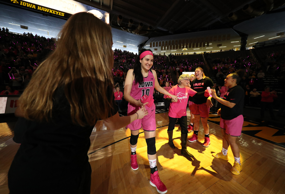 Iowa Hawkeyes forward Megan Gustafson (10) is introduced with a cancer survivor before their game against the seventh ranked Maryland Terrapins Sunday, February 17, 2019 at Carver-Hawkeye Arena. (Brian Ray/hawkeyesports.com)