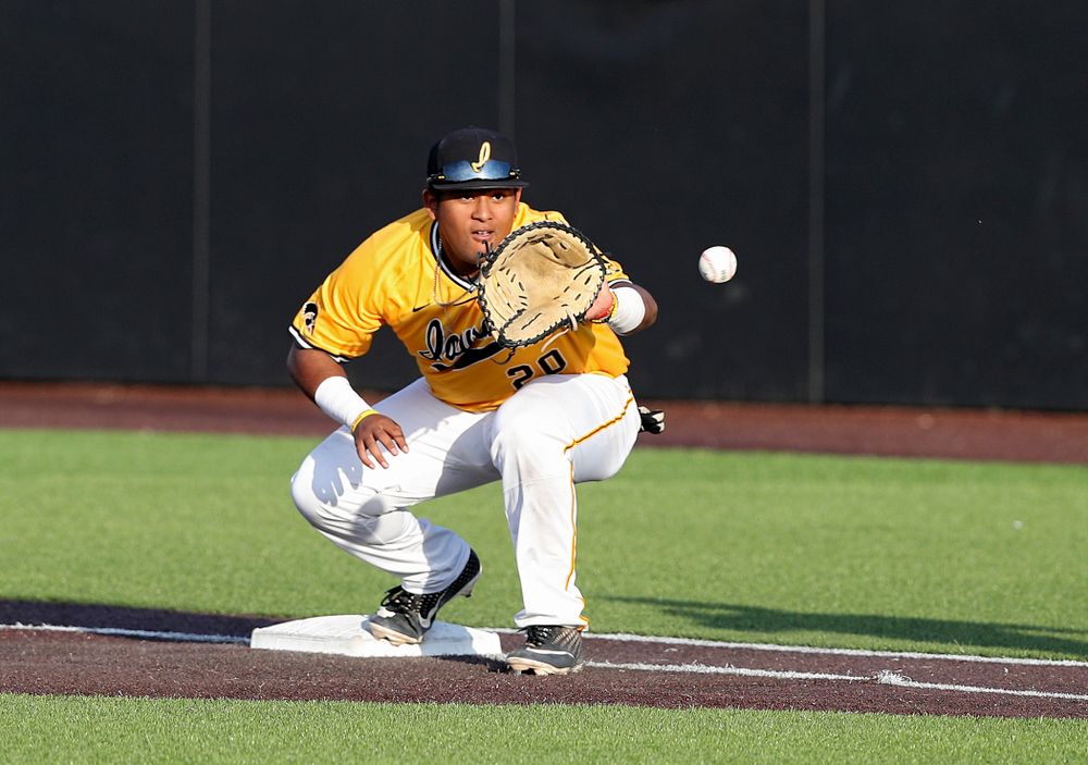 Iowa Hawkeyes first baseman Izaya Fullard (20) pulls in a throw for an out during the seventh inning of their game against Northern Illinois at Duane Banks Field in Iowa City on Tuesday, Apr. 16, 2019. (Stephen Mally/hawkeyesports.com)