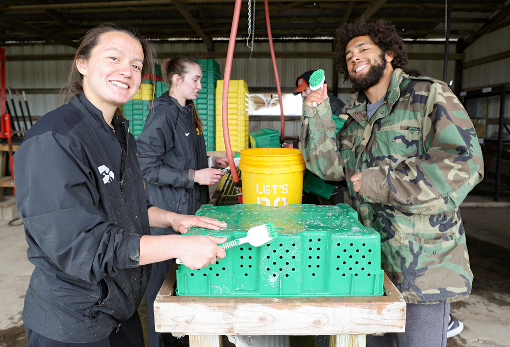 Iowa soccer players wash items for Grow: Johnson County at the Johnson County Historic Poor Farm during the 21st annual ISAAC Hawkeye Day of Caring in Iowa City on Sunday, Apr. 28, 2019. (Stephen Mally/hawkeyesports.com)