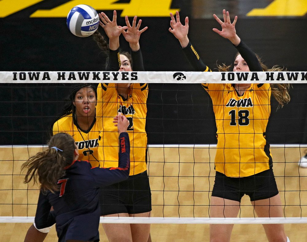 Iowa’s Courtney Buzzerio (2) blocks a shot as Hannah Clayton (18) looks on during the first set of their match against Illinois at Carver-Hawkeye Arena in Iowa City on Wednesday, Nov 6, 2019. (Stephen Mally/hawkeyesports.com)