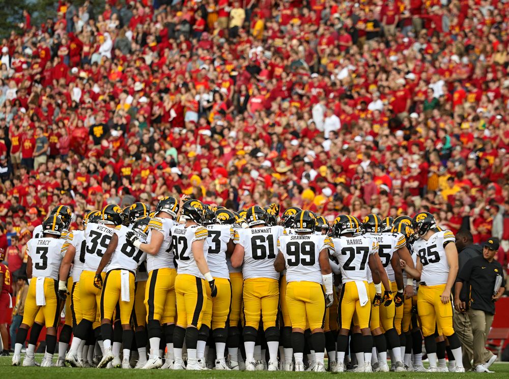 The Iowa Hawkeyes huddle after warming up following a weather delay during the first quarter of their Iowa Corn Cy-Hawk Series game at Jack Trice Stadium in Ames on Saturday, Sep 14, 2019. (Stephen Mally/hawkeyesports.com)