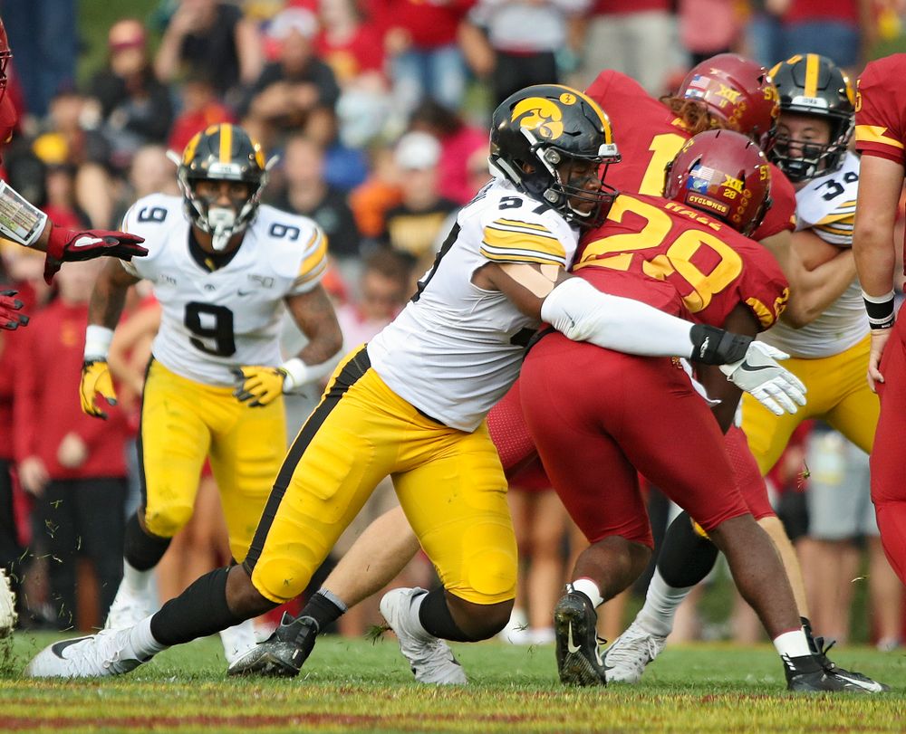 Iowa Hawkeyes defensive end Chauncey Golston (57) makes a tackle during the first quarter of their Iowa Corn Cy-Hawk Series game at Jack Trice Stadium in Ames on Saturday, Sep 14, 2019. (Stephen Mally/hawkeyesports.com)
