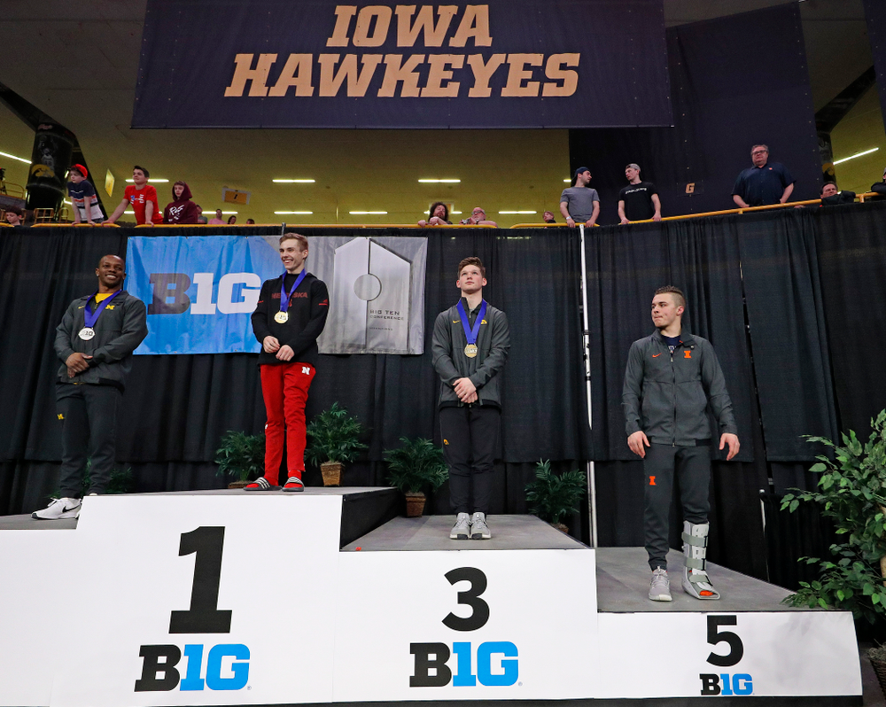 Iowa's Stewart Brown receives a bronze medal for this
third place finish in the vault during the second day of the Big Ten Men's Gymnastics Championships at Carver-Hawkeye Arena in Iowa City on Saturday, Apr. 6, 2019. (Stephen Mally/hawkeyesports.com)