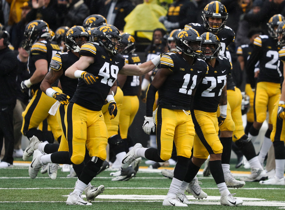 Iowa Hawkeyes defensive back Michael Ojemudia (11) celebrates after making an interception during a game against Nebraska at Kinnick Stadium on November 23, 2018. (Tork Mason/hawkeyesports.com)