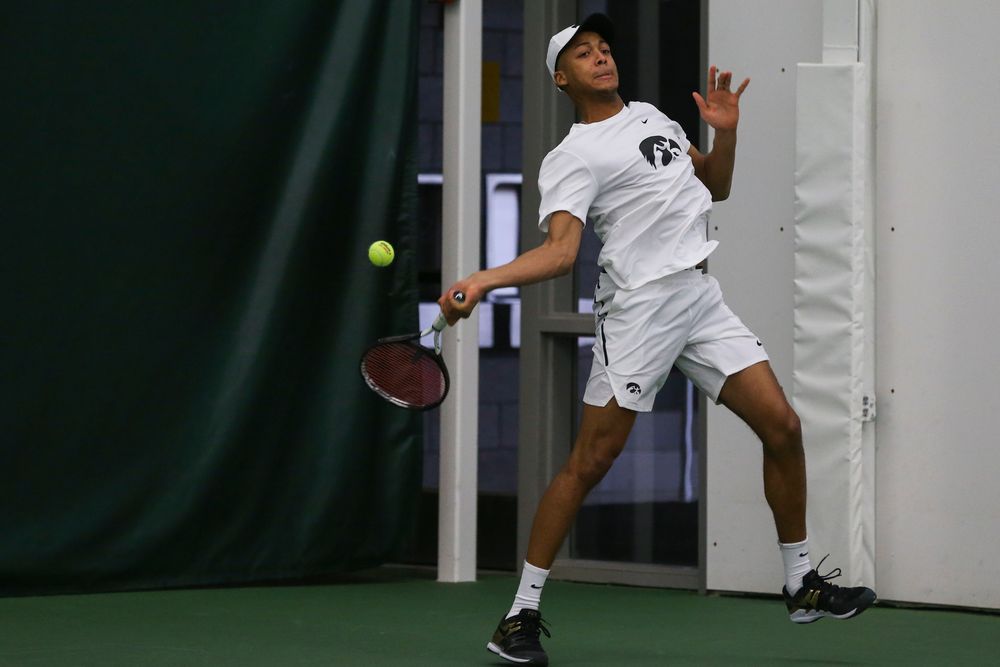 Iowa’s Oliver Okonkwo hits a forehand during the Iowa men’s tennis match vs Western Michigan on Saturday, January 18, 2020 at the Hawkeye Tennis and Recreation Complex. (Lily Smith/hawkeyesports.com)