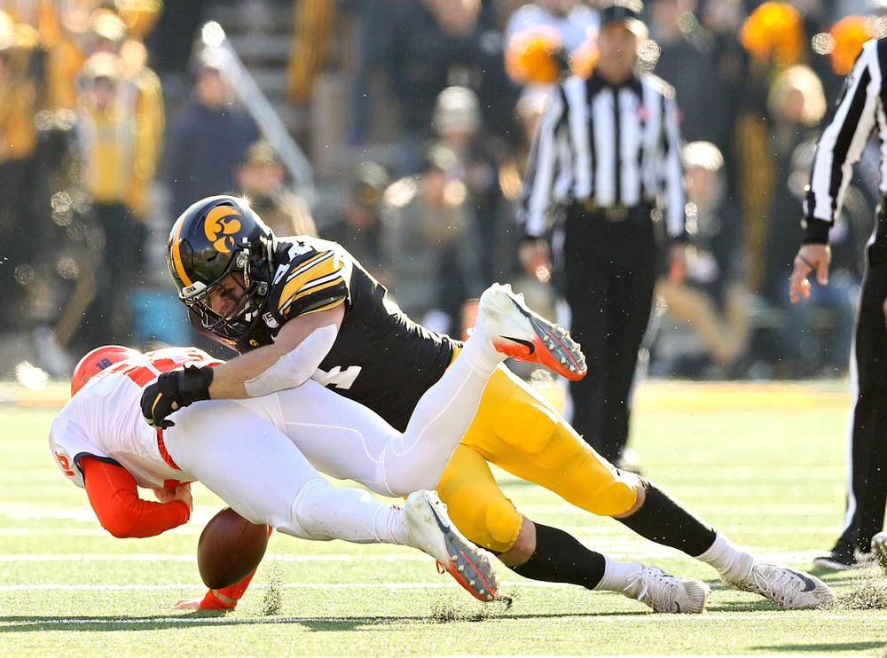 Iowa Hawkeyes linebacker Kristian Welch (34) forces Illinois Fighting Illini quarterback Brandon Peters (18) to fumble the ball during the fourth quarter of their game at Kinnick Stadium in Iowa City on Saturday, Nov 23, 2019. (Stephen Mally/hawkeyesports.com)