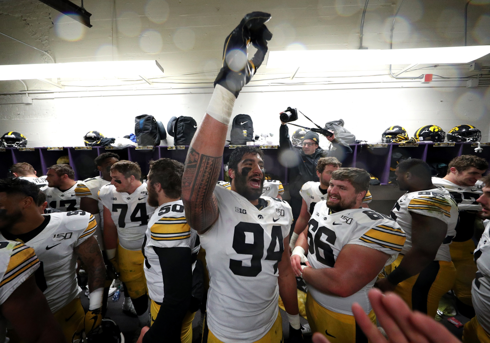 Iowa Hawkeyes defensive end A.J. Epenesa (94) celebrates their victory against the Northwestern Wildcats Saturday, October 26, 2019 at Ryan Field in Evanston, Ill. (Brian Ray/hawkeyesports.com)