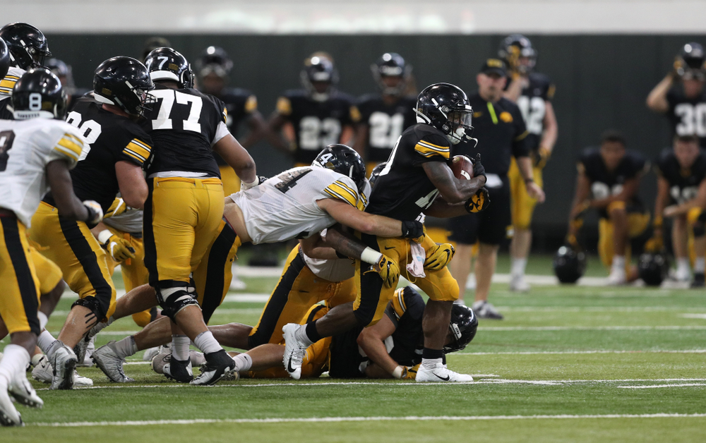 Iowa Hawkeyes running back Mekhi Sargent (10) and linebacker Kristian Welch (34) During Fall Camp Practice No. 6 Thursday, August 8, 2019 at the Ronald D. and Margaret L. Kenyon Football Practice Facility. (Brian Ray/hawkeyesports.com)
