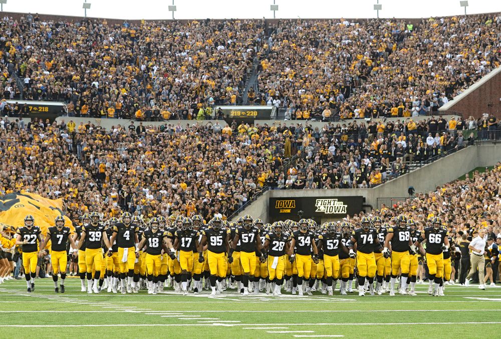 The Hawkeyes swarm as they take the field for their game at Kinnick Stadium in Iowa City on Saturday, Aug 31, 2019. (Stephen Mally/hawkeyesports.com)