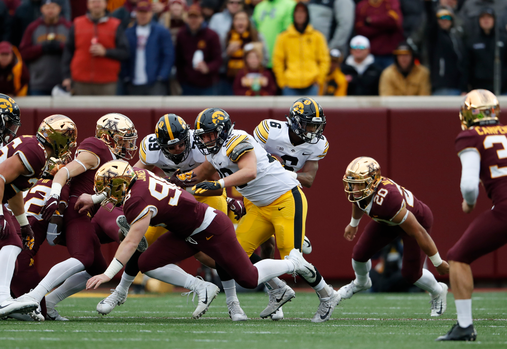 Iowa Hawkeyes fullback Brady Ross (36) blocks for wide receiver Ihmir Smith-Marsette (6) as he returns a kick against the Minnesota Golden Gophers Saturday, October 6, 2018 at TCF Bank Stadium. (Brian Ray/hawkeyesports.com)