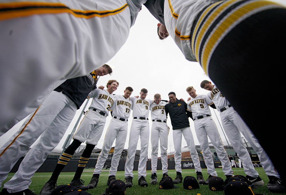 The Hawkeyes huddle before their college baseball game at Duane Banks Field in Iowa City on Wednesday, March 11, 2020. (Stephen Mally/hawkeyesports.com)