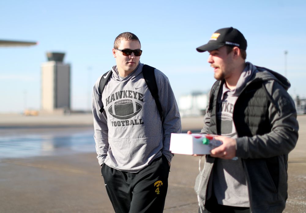 Iowa Hawkeyes quarterback Nate Stanley (4) boards the team plane at the Eastern Iowa Airport Saturday, December 21, 2019 on the way to San Diego, CA for the Holiday Bowl. (Brian Ray/hawkeyesports.com)