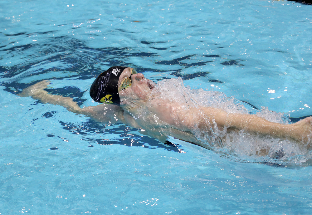 IowaÕs John Colin competes in the 100 yard backstroke against Notre Dame and Illinois Saturday, January 11, 2020 at the Campus Recreation and Wellness Center. (Brian Ray/hawkeyesports.com)