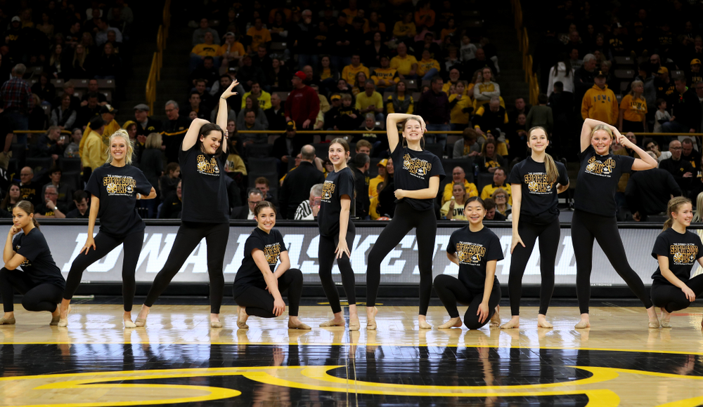 The Iowa Spirit Squad performs with participants in Spirit Squad Day at halftime of the Iowa Hawkeyes game against the Nebraska Cornhuskers Saturday, February 8, 2020 at Carver-Hawkeye Arena. (Brian Ray/hawkeyesports.com)
