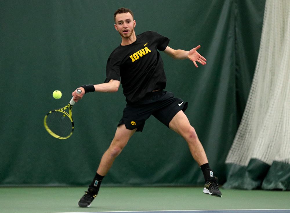 Iowa’s Kareem Allaf returns a shot during his singles match at the Hawkeye Tennis and Recreation Complex in Iowa City on Friday, March 6, 2020. (Stephen Mally/hawkeyesports.com)