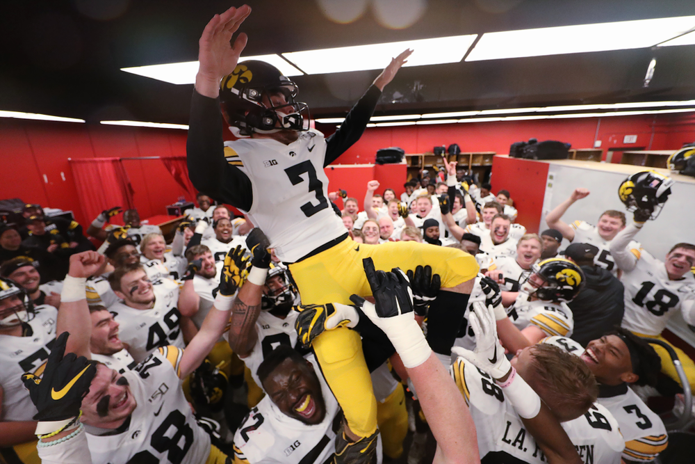 The Iowa Hawkeyes hoist up place kicker Keith Duncan (3) as they celebrate their victory against the Nebraska Cornhuskers Friday, November 29, 2019 at Memorial Stadium in Lincoln, Neb. (Brian Ray/hawkeyesports.com)