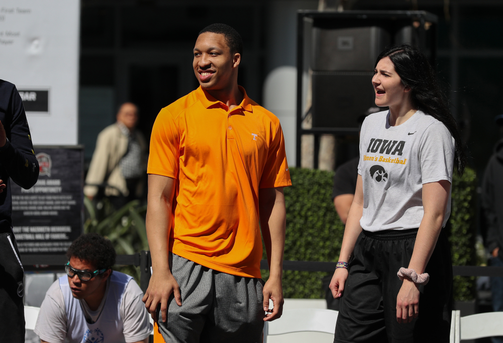 Iowa Hawkeyes forward Megan Gustafson (10) and TennesseeÕs Grant Williams during a Special Olympics event Friday, April 12, 2019 as part of the ESPN College Basketball Awards in the XBOX Plaza at LA Live. (Brian Ray/hawkeyesports.com)