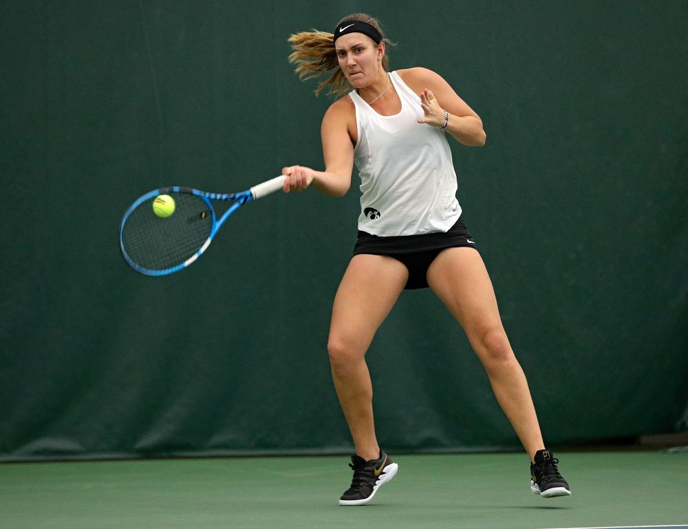 Iowa’s Ashleigh Jacobs returns a shot during her doubles match at the Hawkeye Tennis and Recreation Complex in Iowa City on Sunday, February 23, 2020. (Stephen Mally/hawkeyesports.com)