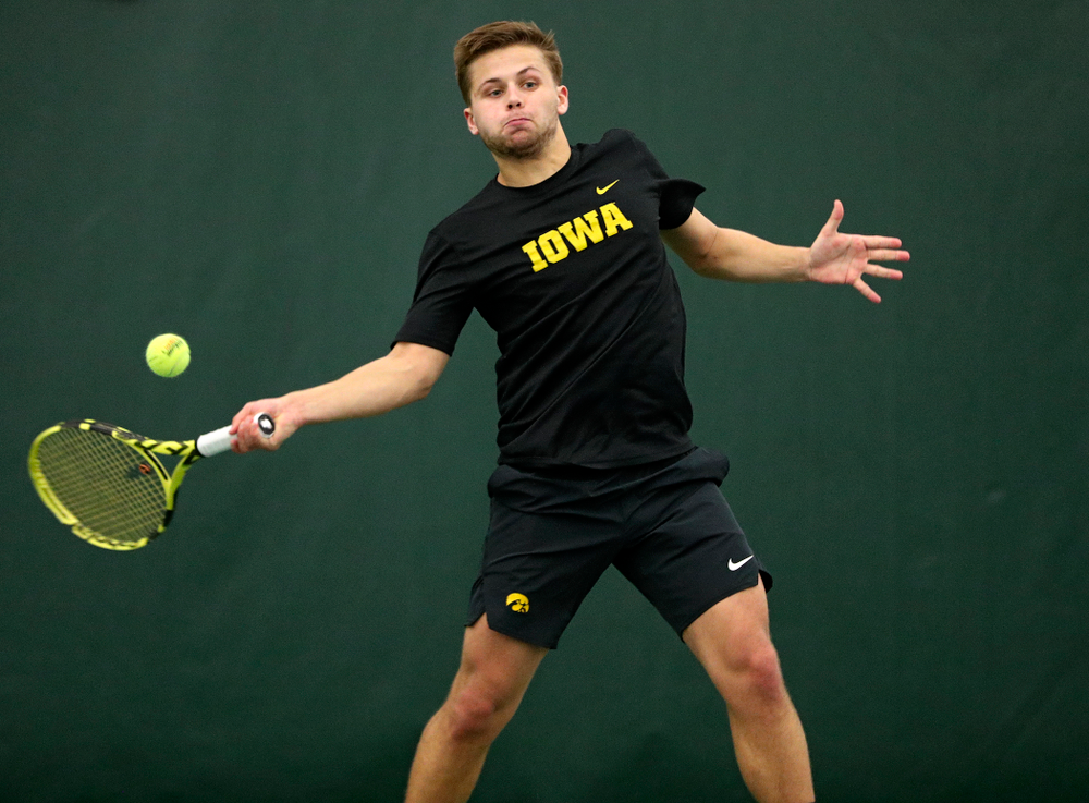 Iowa’s Will Davies returns a shot during his singles match at the Hawkeye Tennis and Recreation Complex in Iowa City on Friday, February 14, 2020. (Stephen Mally/hawkeyesports.com)
