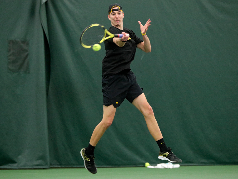 Iowa’s Nikita Snezhko returns a shot during his singles match at the Hawkeye Tennis and Recreation Complex in Iowa City on Friday, February 14, 2020. (Stephen Mally/hawkeyesports.com)