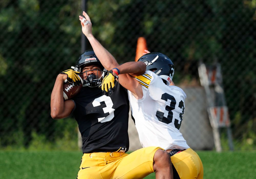 Iowa Hawkeyes wide receiver Tyrone Tracy Jr. (3) and defensive back Riley Moss (33) during camp practice No. 16 Tuesday, August 21, 2018 at the Hansen Football Performance Center. (Brian Ray/hawkeyesports.com)