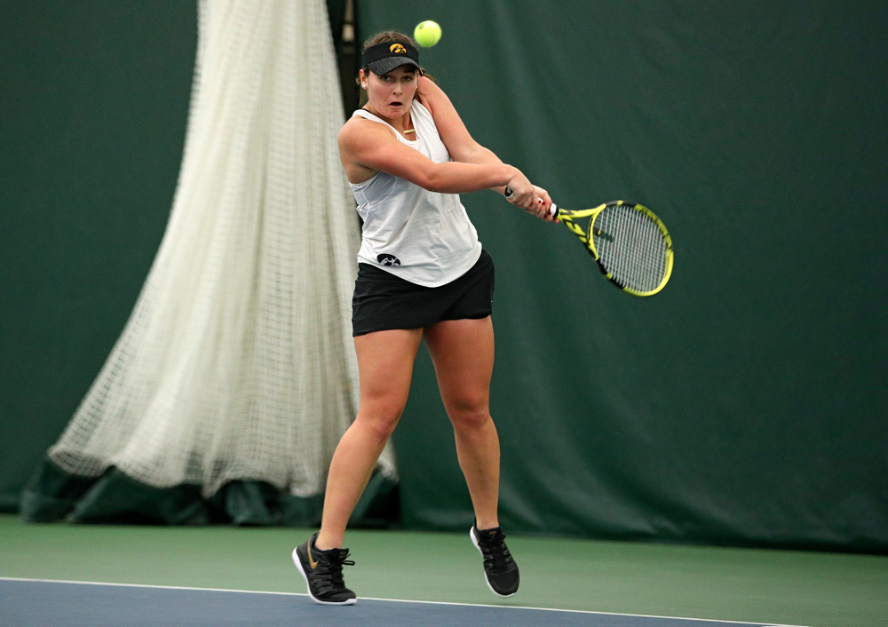 Iowa’s Danielle Bauers returns a shot during her singles match at the Hawkeye Tennis and Recreation Complex in Iowa City on Sunday, February 23, 2020. (Stephen Mally/hawkeyesports.com)