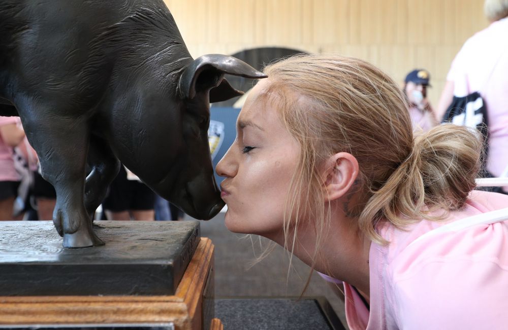 A woman kisses the Floyd of Rosedale Trophy during the 2019 Iowa Ladies Football Academy Saturday, June 8, 2019 at the Hansen Football Performance Center. (Brian Ray/hawkeyesports.com)