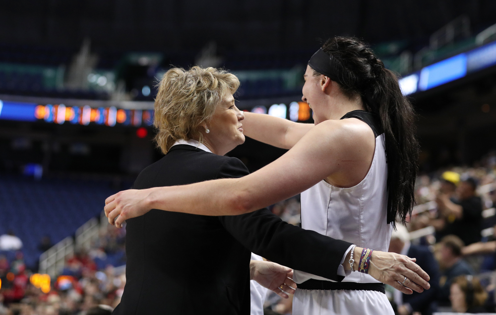 Iowa Hawkeyes head coach Lisa Bluder and forward Megan Gustafson (10) against the NC State Wolfpack in the regional semi-final of the 2019 NCAA Women's College Basketball Tournament Saturday, March 30, 2019 at Greensboro Coliseum in Greensboro, NC.(Brian Ray/hawkeyesports.com)