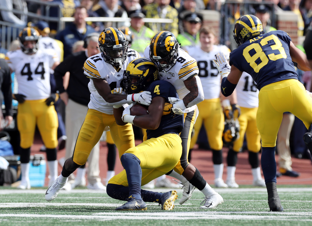 Iowa Hawkeyes defensive back Geno Stone (9) and defensive back Michael Ojemudia (11) against the Michigan Wolverines Saturday, October 5, 2019 at Michigan Stadium in Ann Arbor, MI. (Brian Ray/hawkeyesports.com)
