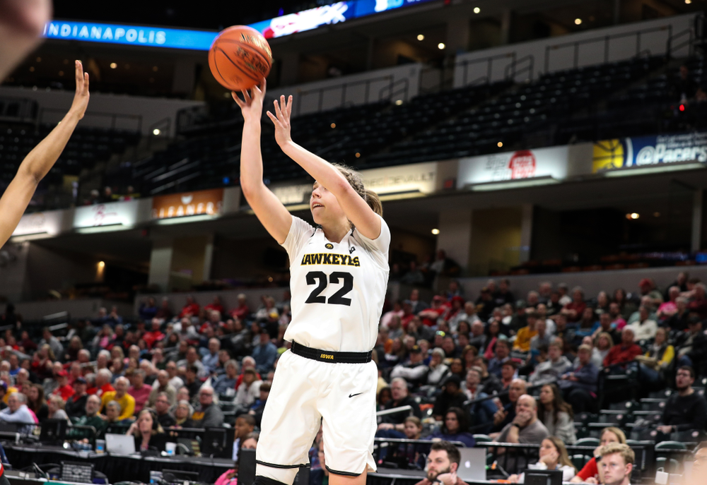 Iowa Hawkeyes guard Kathleen Doyle (22) knocks down a three point basket against the Rutgers Scarlet Knights in the semi-finals of the Big Ten Tournament Saturday, March 9, 2019 at Bankers Life Fieldhouse in Indianapolis, Ind. (Brian Ray/hawkeyesports.com)