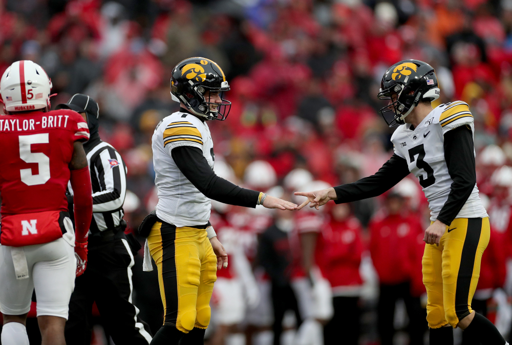 Iowa Hawkeyes place kicker Keith Duncan (3) beats punter Colten Rastetter (7) at Rock Paper Scissors after a kick against the Nebraska Cornhuskers Friday, November 29, 2019 at Memorial Stadium in Lincoln, Neb. (Brian Ray/hawkeyesports.com)