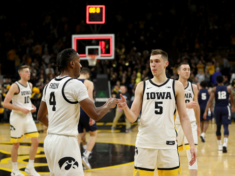 Iowa Hawkeyes guard Bakari Evelyn (4) and guard CJ Fredrick (5) celebrate their win against Penn State Saturday, February 29, 2020 at Carver-Hawkeye Arena. (Brian Ray/hawkeyesports.com)