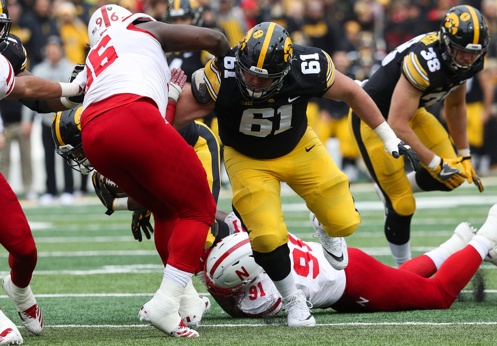 Iowa Hawkeyes offensive lineman Cole Banwart (61) blocks during a game against Nebraska at Kinnick Stadium on November 23, 2018. (Tork Mason/hawkeyesports.com)