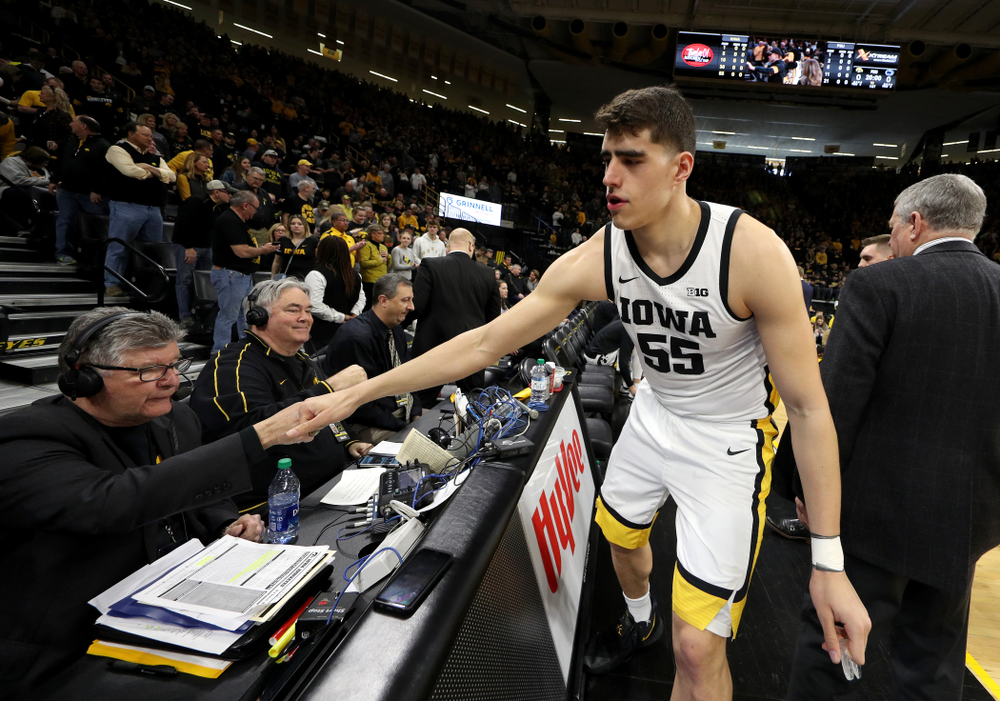 Iowa Hawkeyes forward Luka Garza (55) fist bumps the radio crew before their game against Penn State Saturday, February 29, 2020 at Carver-Hawkeye Arena. (Brian Ray/hawkeyesports.com)