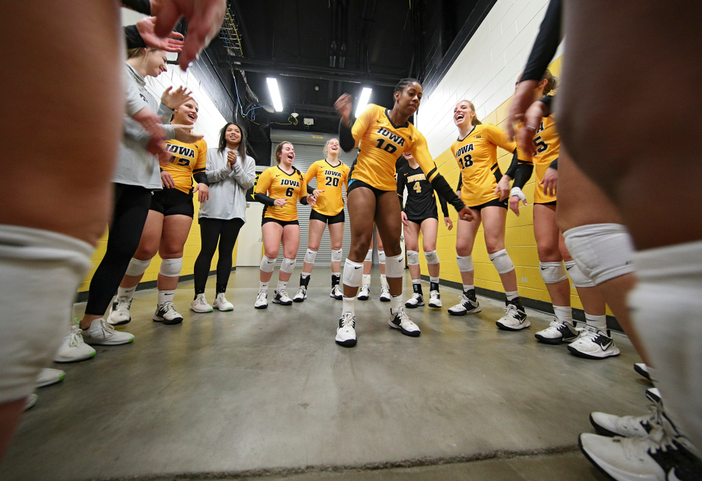 Iowa’s Griere Hughes (10) dances in her team’s huddle before their match against Illinois at Carver-Hawkeye Arena in Iowa City on Wednesday, Nov 6, 2019. (Stephen Mally/hawkeyesports.com)