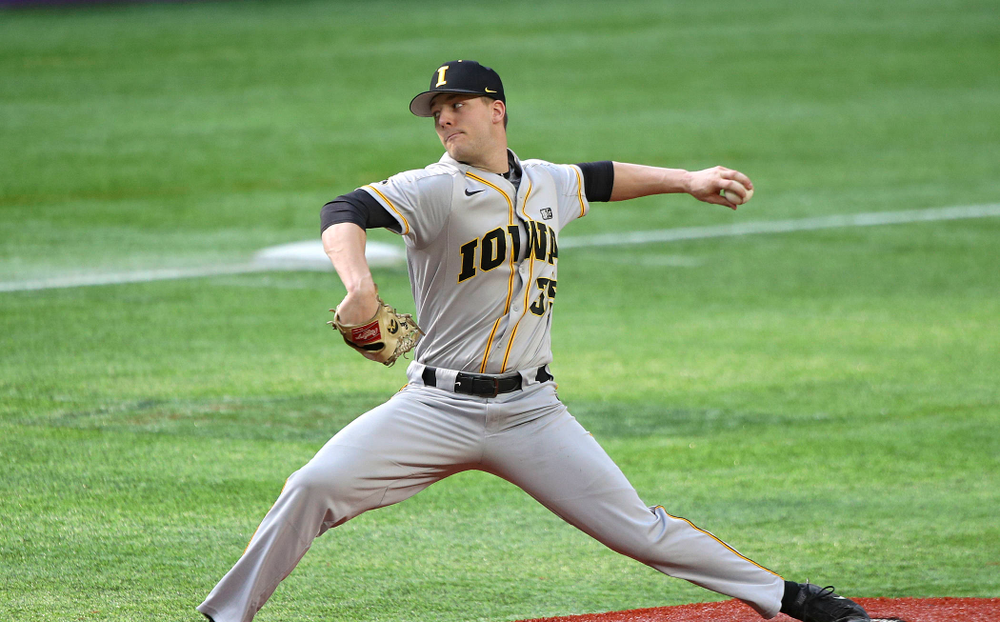 Iowa Hawkeyes pitcher Cam Baumann (35) delivers to the plate during the eighth inning of their CambriaCollegeClassic game at U.S. Bank Stadium in Minneapolis, Minn. on Friday, February 28, 2020. (Stephen Mally/hawkeyesports.com)