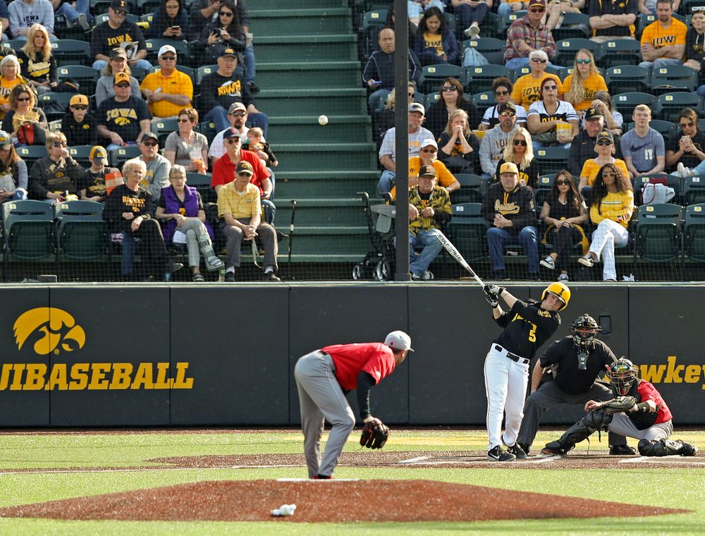Iowa Hawkeyes first baseman Zeb Adreon (5) hits a 2-run double during the seventh inning of their game against Rutgers at Duane Banks Field in Iowa City on Saturday, Apr. 6, 2019. (Stephen Mally/hawkeyesports.com)