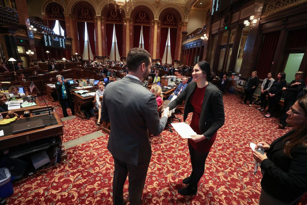 Iowa’s Megan Gustafson shakes hands with state senator Zach Wahls after being recognized with a resolution in the senate chamber at the Iowa State Capitol Wednesday, April 24, 2019 in Des Moines. (Brian Ray/hawkeyesports.com)