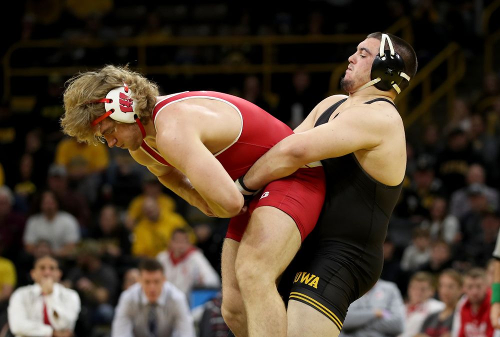 IowaÕs Tony Cassioppi wrestles WisconsinÕs Trent Hillger at heavyweight Sunday, December 1, 2019 at Carver-Hawkeye Arena. Cassioppi won the match 3-2. (Brian Ray/hawkeyesports.com)