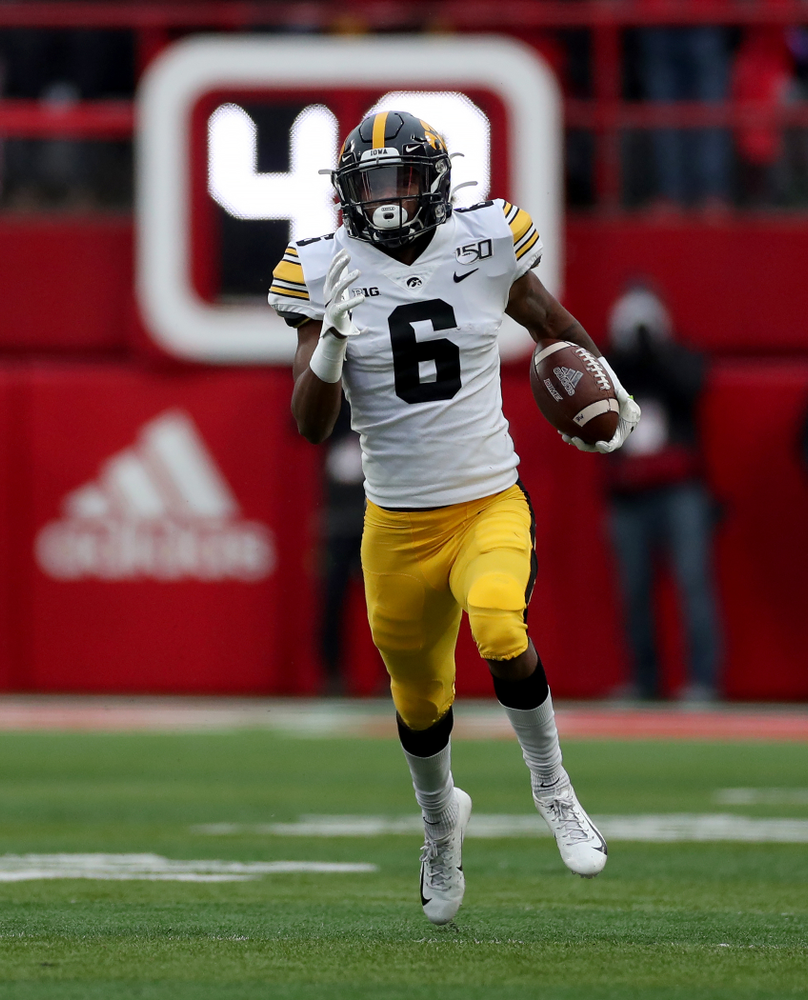 Iowa Hawkeyes wide receiver Ihmir Smith-Marsette (6) returns a kickoff for a touchdown against the Nebraska Cornhuskers Friday, November 29, 2019 at Memorial Stadium in Lincoln, Neb. (Brian Ray/hawkeyesports.com)