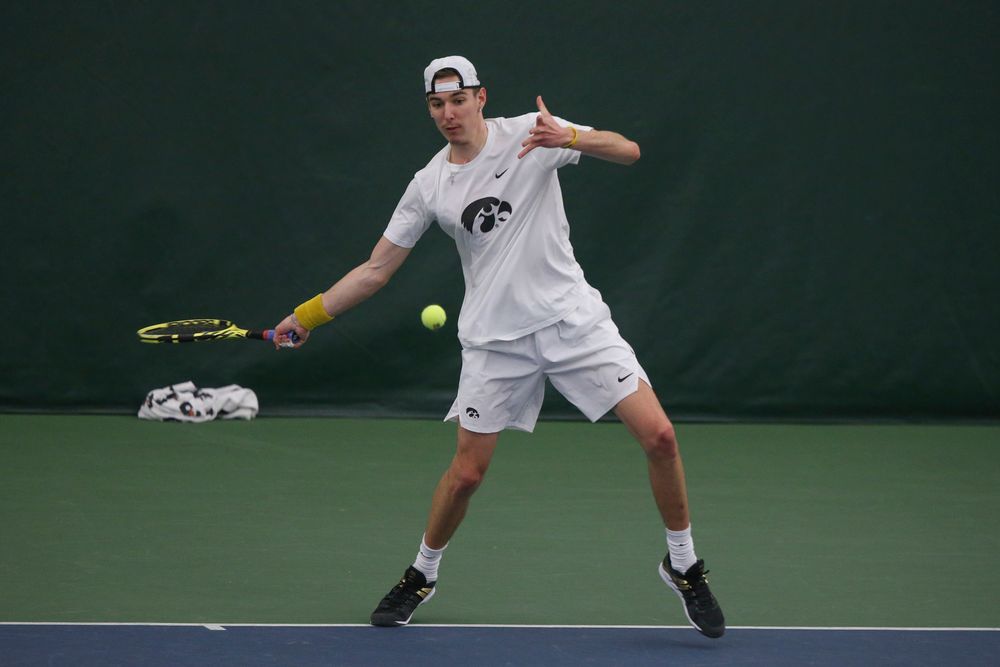 Iowa’s Nikita Snezhko returns a hit during the Iowa men’s tennis meet vs Nebraska on Sunday, March 1, 2020 at the Hawkeye Tennis and Recreation Complex. (Lily Smith/hawkeyesports.com)