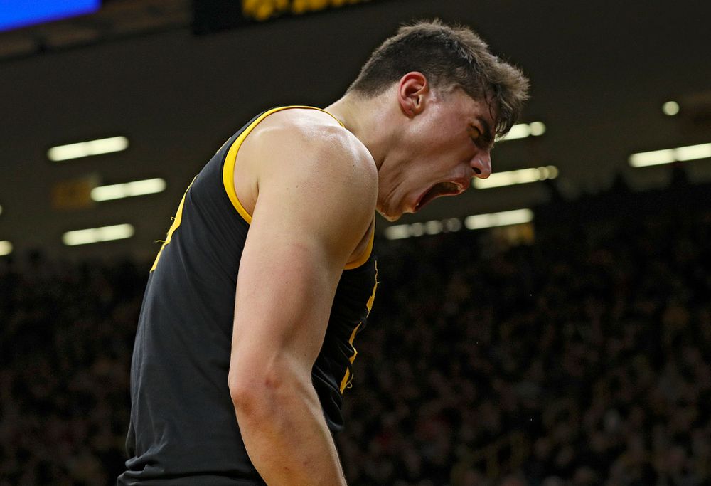 Iowa Hawkeyes center Luka Garza (55) is pumped up after scoring a basket while being fouled during the first half of their game at Carver-Hawkeye Arena in Iowa City on Monday, January 27, 2020. (Stephen Mally/hawkeyesports.com)