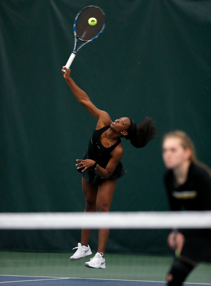 Adorable Huckleby and Zoe Douglas play a doubles match against Ohio State Sunday, March 25, 2018 at the Hawkeye Tennis and Recreation Center. (Brian Ray/hawkeyesports.com)
