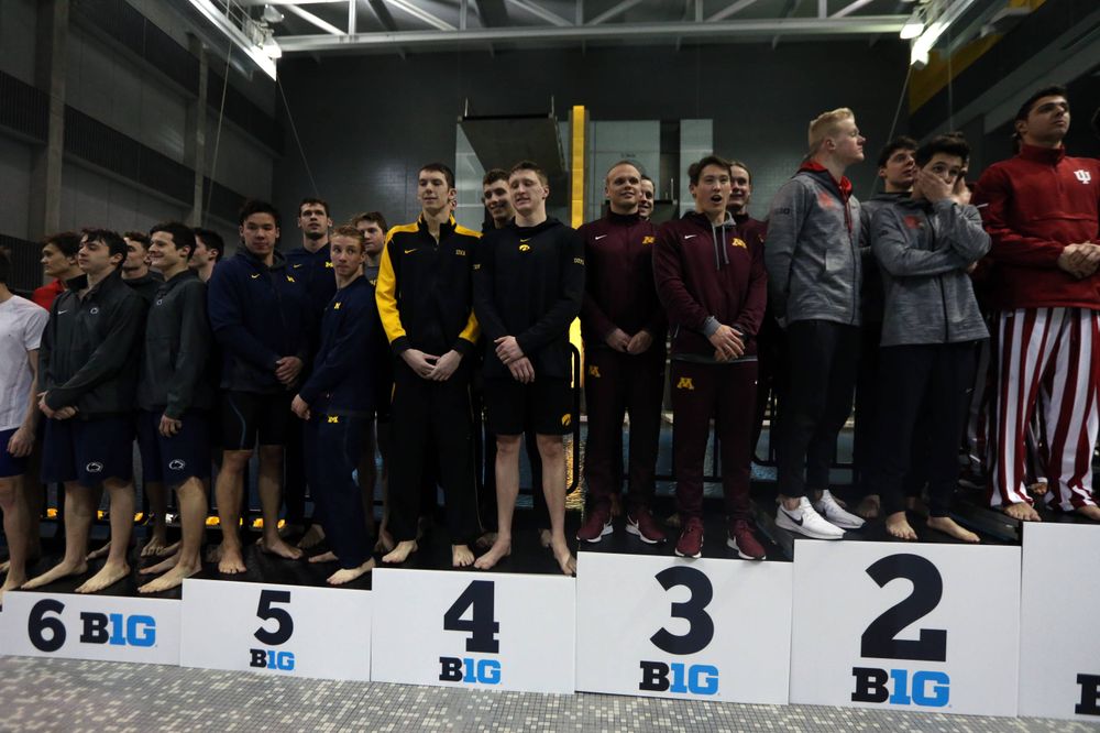 Iowa's Joe Myhre, Jack Smith, Will Scott, and Steve Fiolic after the 200-yard freestyle relay race Friday, March 1, 2019 at the Campus Recreation and Wellness Center. (Lily Smith/hawkeyesports.com)