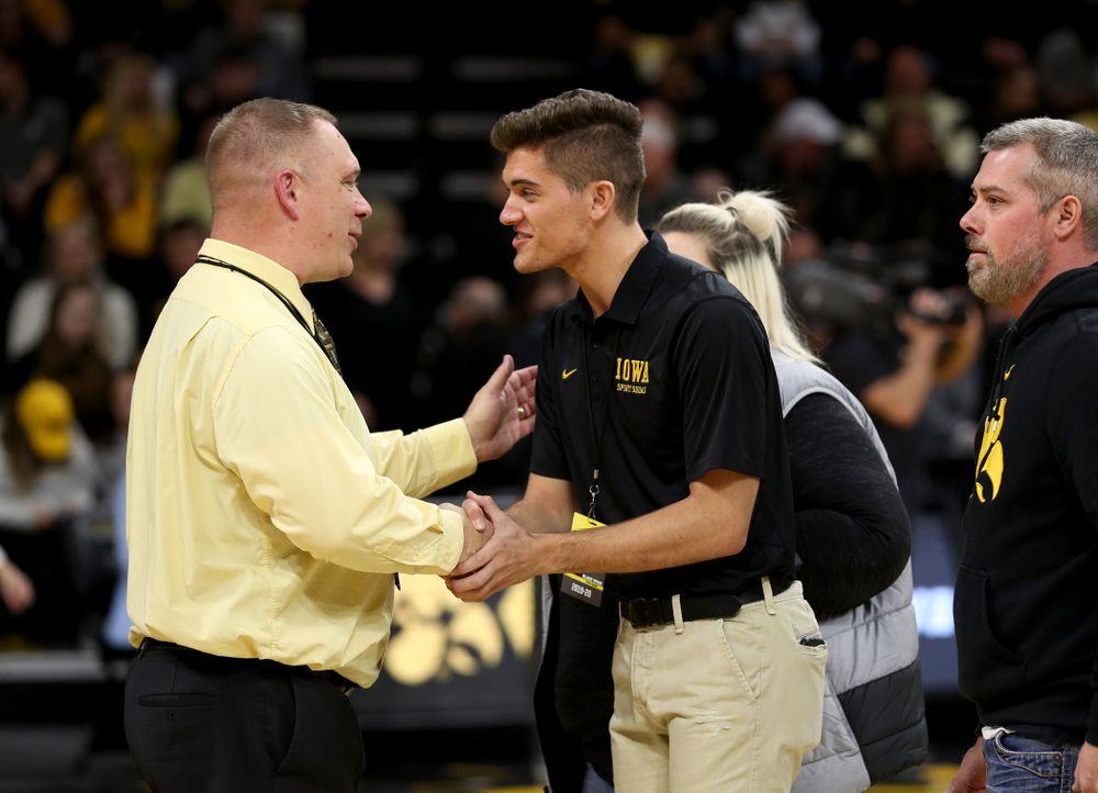 The Iowa Cheerleaders and Dance Team perform on senior night at half-time of the Iowa Hawkeyes game against the Purdue Boilermakers Tuesday, March 3, 2020 at Carver-Hawkeye Arena. (Brian Ray/hawkeyesports.com)