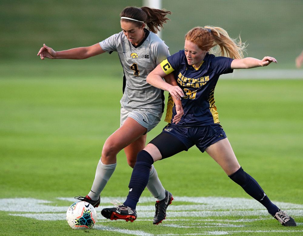 Iowa forward Kaleigh Haus (4) tries to get around a defender during the first half of their match at the Iowa Soccer Complex in Iowa City on Friday, Sep 13, 2019. (Stephen Mally/hawkeyesports.com)