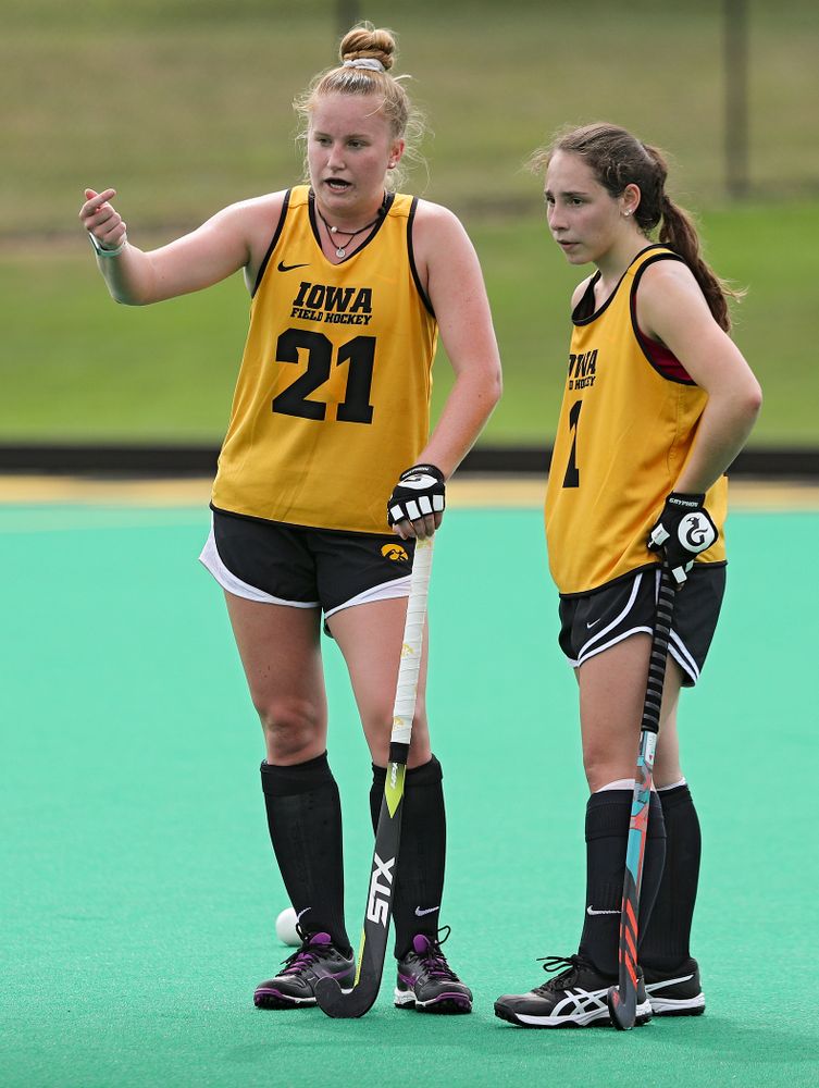 Iowa’s Makenna Maguire (21) talks with Amy Gaiero (1) as they work on a drill during practice at Grant Field in Iowa City on Thursday, Aug 15, 2019. (Stephen Mally/hawkeyesports.com)