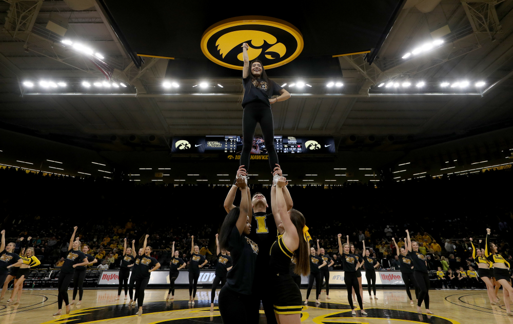 The Iowa Spirit Squad performs with participants in Spirit Squad Day at halftime of the Iowa Hawkeyes game against the Nebraska Cornhuskers Saturday, February 8, 2020 at Carver-Hawkeye Arena. (Brian Ray/hawkeyesports.com)