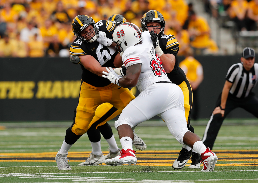 Iowa Hawkeyes offensive lineman Cole Banwart (61) and offensive lineman Keegan Render (69) against the Northern Illinois Huskies Saturday, September 1, 2018 at Kinnick Stadium. (Brian Ray/hawkeyesports.com)