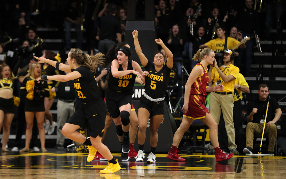 Iowa Hawkeyes forward Megan Gustafson (10) and guard Alexis Sevillian (5) celebrate their 73-70 win against the Iowa State Cyclones in the Iowa Corn Cy-Hawk Series Wednesday, December 5, 2018 at Carver-Hawkeye Arena. (Brian Ray/hawkeyesports.com)